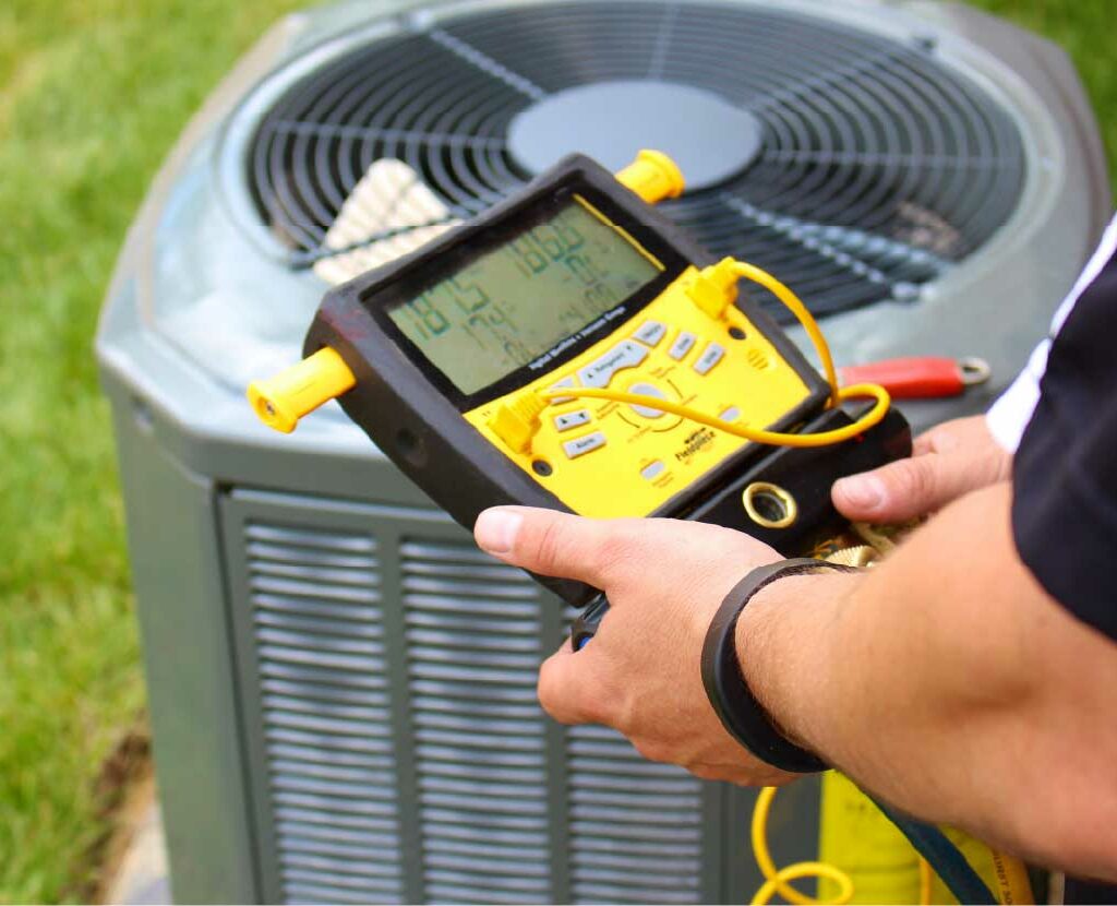 Technician testing an air conditioning unit in Winter Garden, FL