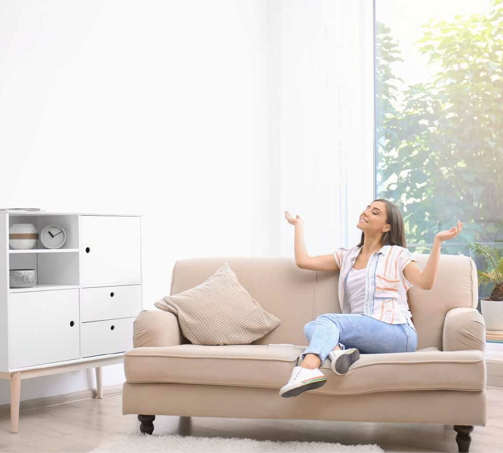 Woman feeling relaxed in a well-lit room with Cloud 9 AC in Winter Garden, FL